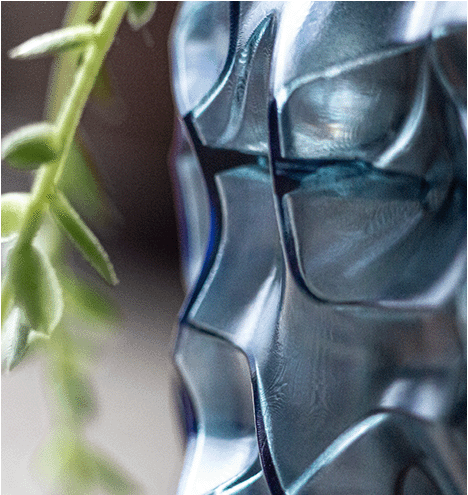 Macro shot of a paramaterically generated bumpy surface of a 3D printed flowerpot in the shades of blue