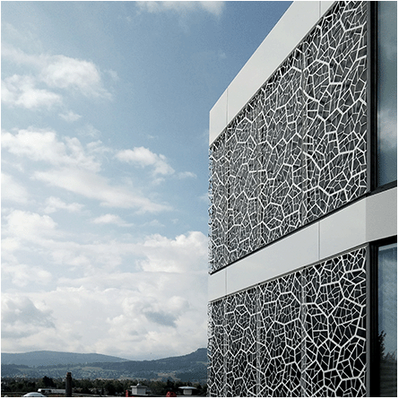 Photo of a white metal facade with a cellular structure of a single-family house designed during work at Frisina Architekten