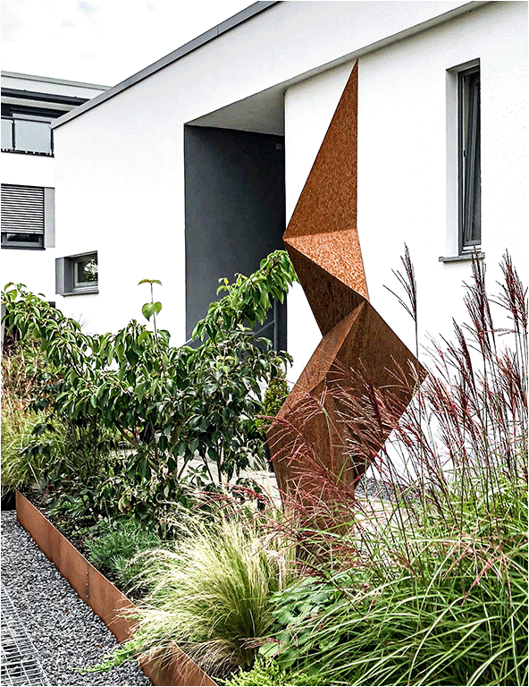 Large outdoor sculpture in corten steel abstractly depicting the shape of a polygonised sea Kelp leaf.